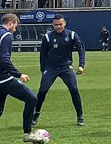 Simmons warming up with a teammate