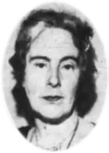 A black-and-white photograph of a woman's head