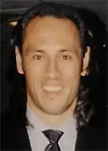 Headshot of Hateley in a suit.