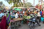 Shoppers in an open-air hawkers market in Adalaj.