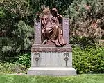 Bronze statue of a seated woman