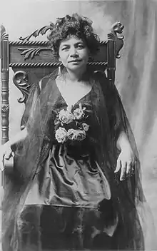 Photo portrait of Mary Atcherley seated in a chair facing the camera