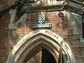 LCC plaque with the school name; the original name and date of the school is incorporated into the arch below the plaque.