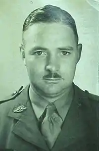 a head and shoulders mugshot of a male in uniform