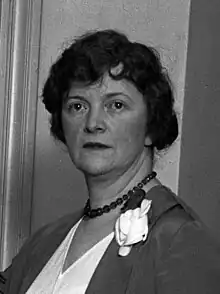 Head-and-shoulders photograph of a Caucasian woman with short, wavy hair