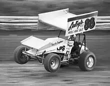 Sprint car performing a wheelie