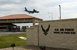 The main gate at MacDill AFB, with a KC-135R Stratotanker overhead.