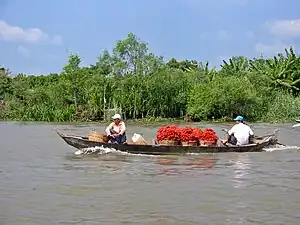 The district is connected to the Mekong via the Hậu River. The district along the river served as a stop off point by traders on the way to Phnom Penh.