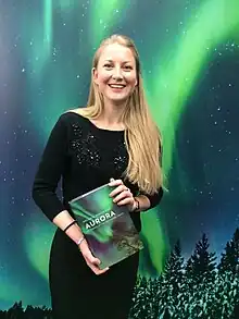 Melanie Windridge holding her book.