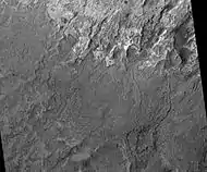 Melas Chasma Fluvial Channels, as seen by HiRISE.  Click on image to see meandering and branching channels made with running water in the past.