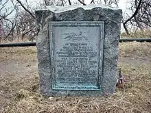 Memorial plaque and stone