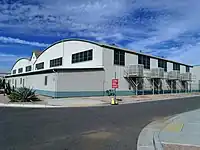 Demountable Hangar, located at the North Apron, Phoenix–Mesa Gateway Airport (formerly Williams AFB). Built in 1942 and designed by the Del E. Webb Construction Company to resemble an enlisted aviator badge of the Army Air Force. Listed on the National Register of Historic Places in 1995, ref. #95000743.