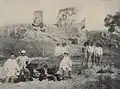 Bendegó meteorite in a photograph by H. Antunes, taken in 1887, showing the meteorite still on the bank of the Bendegó stream, with vice admiral José Carlos de Carvalho and engineers Humberto Saraiva Antunes and Vicente José de Carvalho.