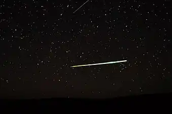 Sporadic bolide over the desert of Central Australia and a Lyrid (top edge)