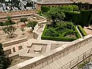 Foundations of the mosque at the southeast corner (now filled by a garden), as well as its minaret (small square structure, lower left)