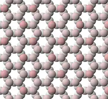 View of tetrahedral sheet structure of biotite. The apical oxygen ions are tinted pink.