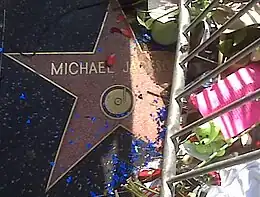 Jackson's star on the Hollywood Walk of Fame, showing flowers for fans to express grief.