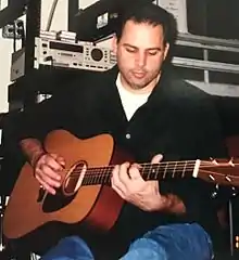 Mangini playing guitar