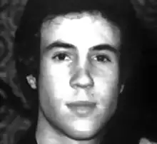 A black and white photo of a young white man's head, slightly overexposed