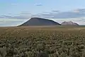 West aspect of Middle Butte centered with East Butte in the distance