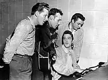 Photograph taken during the recording session. L-R: Jerry Lee Lewis, Carl Perkins, Elvis Presley and Johnny Cash