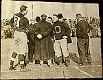 Milton Portmann (Left) shakes hands with Oberlin captain Glen Gray (Right) November 5, 1910