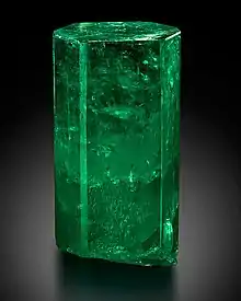 Large, di-hexagonal prismatic crystal of 1,390 carats uncut with a deep green color. It is transparent and features few inclusions in the upper 2/3, and is translucent in the lower part.