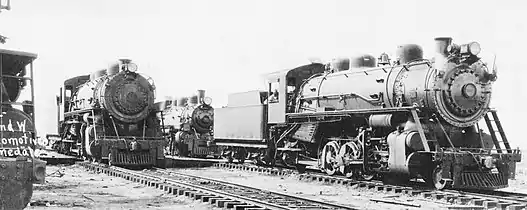 The Minarets and Western Locomotives 102 and 103 stand in front of 101 in Pinedale.