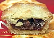 Mince pie is a small British fruit-based mincemeat sweet pie traditionally served during the Christmas season.