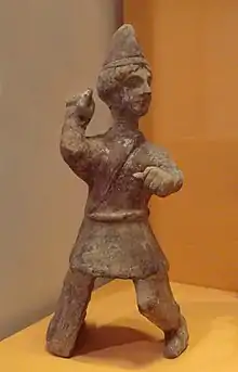 Mingqi (Chinese funerary statuette) of a young Central Asian man, with Saka-type caftan and conical hat reminiscent of early 3rd century AD Kushans. Later Han, 3rd century AD. Guimet Museum (MA 4660).