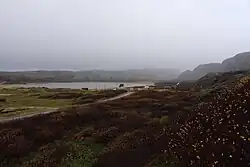 A southbound picture of Grense Jakobselv village; the left side of the river belongs to Russia and the right side to Norway.