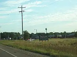 Welcome sign and houses in Mole Lake