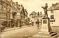 Punch house shown on the right of the Rolls Statue. The picture taken in 1910 also shows a plain wall where a window is now.