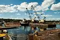 View of tugs and barges at Moody Fabrication.