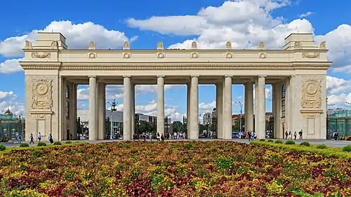 Image 12Gorky ParkPhotograph credit: Alexander SavinGorky Park is a park in central Moscow, Russia, inaugurated in 1928 following the use of the site in 1923 for the First All-Russian Agricultural and Handicraft Industries Exhibition. The park was named after the writer and political activist Maxim Gorky. It underwent a major reconstruction in 2011; nearly all the amusement rides and other attractions were removed, extensive lawns and flower beds were created, and new roadways were laid. A 15,000 m2 (160,000 sq ft) ice rink was installed at the same time. This picture shows the colonnaded main portal of Gorky Park.More selected pictures