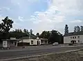 A bus stop and shops in Moshchun