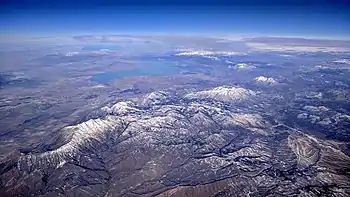 Mount Nebo (left of center) aerial view from the south, with Utah Lake and the rest of the Wasatch Range in the background and the Great Salt Lake on the far left horizon