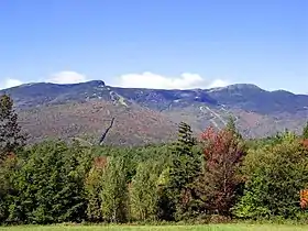 Image 11Mount Mansfield, at 4,393 feet (1,339 m), is the highest-elevation point in Vermont. Other high points are Killington Peak, Mount Ellen, Mount Abraham, and Camel's Hump. The lowest point in the state is Lake Champlain at 95 feet (29 m). The state's average elevation is 1,000 feet (300 m). (from History of Vermont)