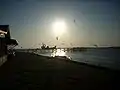 A cargo ship navigating the mouth of the Cape Fear River at Southport