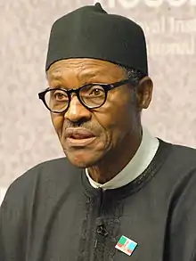 Muhammad Buhari, dressed in black