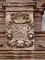 shield on the façade of a house