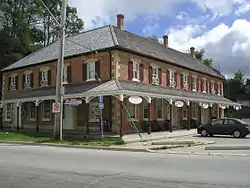 Munshaw House, built in 1864 as a stage coach stop at the junction of Toronto-Sydenham Road and Durham Road.