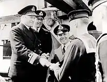 Rear Admiral Murray presenting awards to crew members of HMCS St. Croix, which sank the German submarine U-90 on 24 July 1942