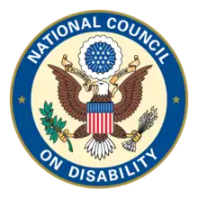 Seal of the National Council on Disability featuring a circle with blue ring and white letters spelling National Council on Disability. In the center is a light cream background and American eagle crest.