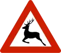 Animals (deer)Warns that deer often traverse or travel on the roads.