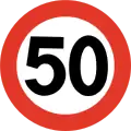 Speed limit of 50 km/h. The standard speed limit for densely populated areas is 50. This is always signposted with this sign, in opposite to many European countries where a sign with the name of the densely populated area itself indicates 50.