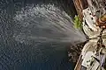 Savannah Bluff Lock and Dam; Water spraying from upstream pool into lock chamber through upper gate as viewed from walkway.