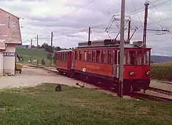 A motor car and trailer at La Cure