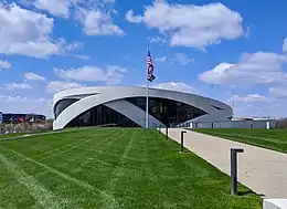 The circular museum with its lawn and flagpole