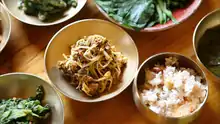 Namul (vegetable side dishes) and kongbap (lower right)